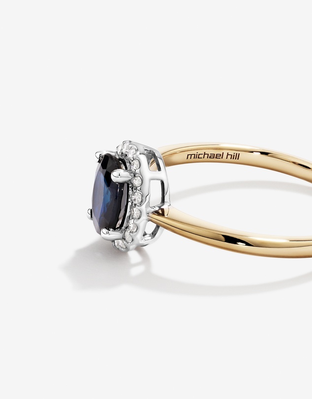 Michael Hill - Oval Cut Blue Sapphire Gemstone and 0.10 Carat TW Diamond Halo Engagement Ring in 10kt Yellow and White Gold