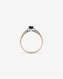 Michael Hill - Oval Cut Blue Sapphire Gemstone and 0.10 Carat TW Diamond Halo Engagement Ring in 10kt Yellow and White Gold