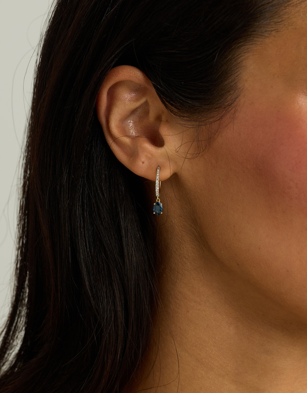 Michael Hill - Australian Sapphire Oval Cut & 0.15 Carat TW Diamond Hoop Drop Earrings in 10kt Yellow Gold with Rhodium