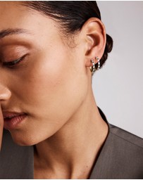 Michael Hill - 0.22 Carat TW Diamond and Created Sapphire Huggie Hoop Earrings in 10kt Yellow Gold