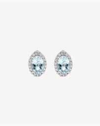 Michael Hill - Oval Cut Blue Aquamarine Gemstone and 0.27 Carat TW Diamond Halo Stud Earrings in 10kt White Gold