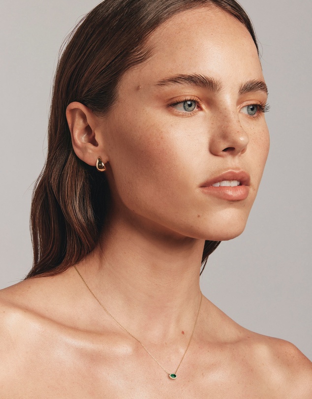 Michael Hill - Oval Cut Green Emerald Gemstone and 0.05 Carat TW Diamond Halo Necklace in 10kt Yellow Gold