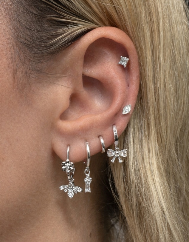 Izoa - Silver Bow Huggie Earrings