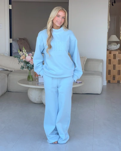 Beginning Boutique - Remy Blue Applique Mock Neck Sweater