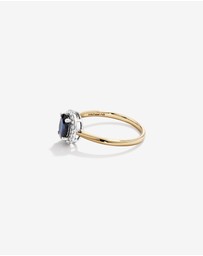 Michael Hill - Oval Cut Blue Sapphire Gemstone and 0.10 Carat TW Diamond Halo Engagement Ring in 10kt Yellow and White Gold