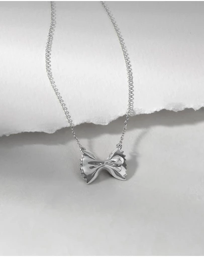 Wanderlust + Co - Bow Tie Pasta Silver Necklace
