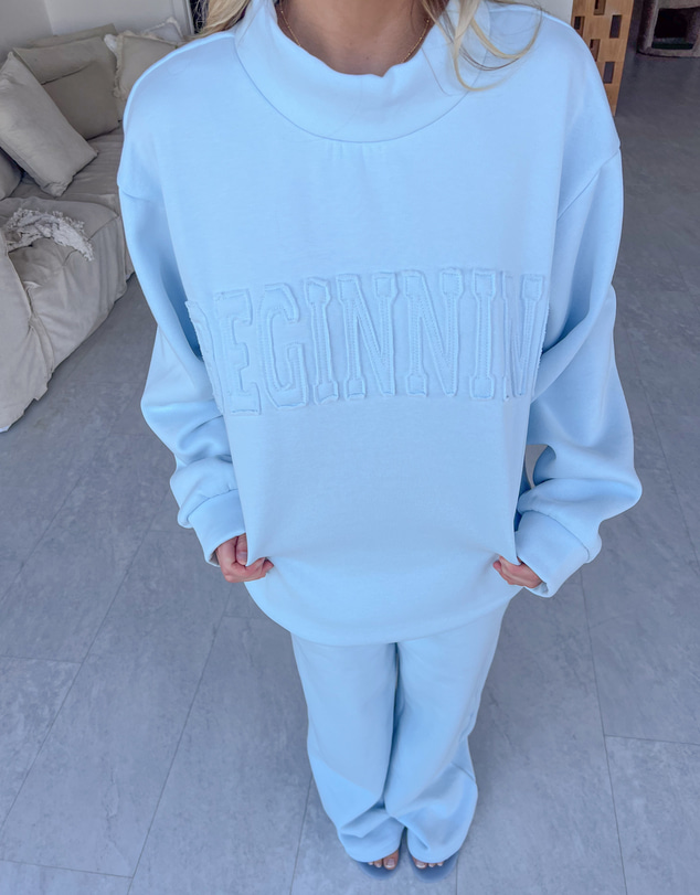 Beginning Boutique - Remy Blue Applique Mock Neck Sweater