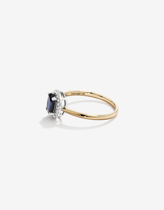 Michael Hill - Oval Cut Blue Sapphire Gemstone and 0.10 Carat TW Diamond Halo Engagement Ring in 10kt Yellow and White Gold