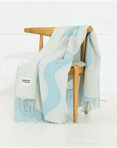 Morgan & Taylor - River Throw Blanket in Beige with a Light Blue Wave Pattern
