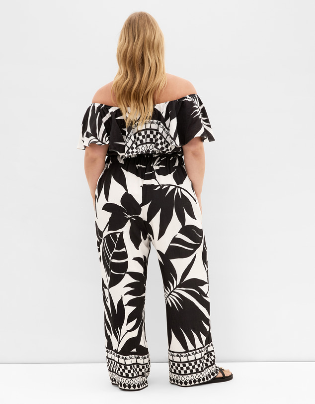 City Chic - Plus size Peta Border Oasis Print Jumpsuit - black