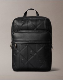 Calvin Klein - Emblem AOP Emboss Round Backpack
