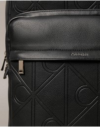 Calvin Klein - Emblem AOP Emboss Round Backpack