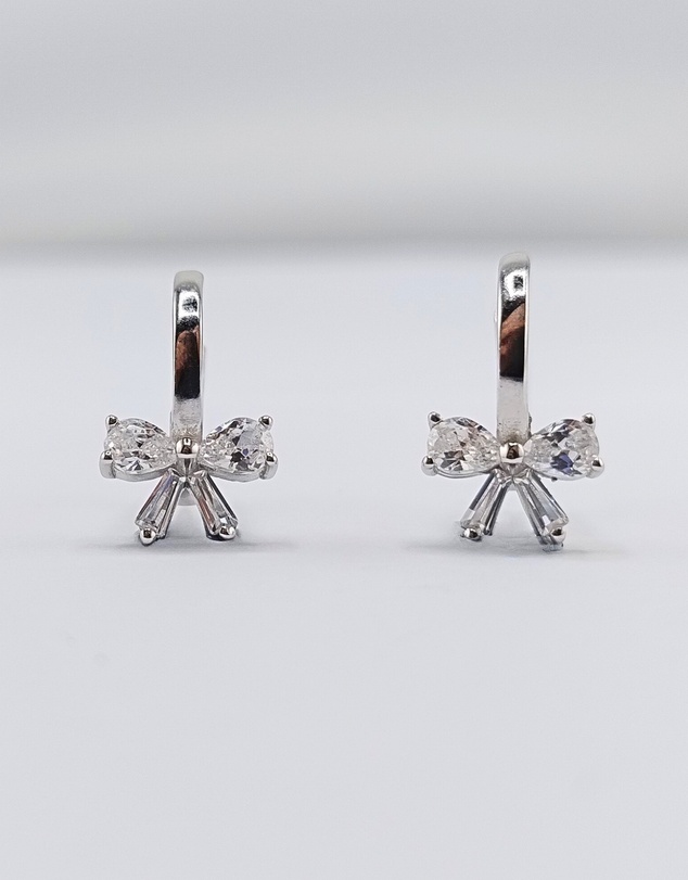 Izoa - Silver Bow Huggie Earrings