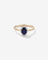 Michael Hill - Oval Cut Blue Sapphire Gemstone and 0.10 Carat TW Diamond Halo Engagement Ring in 10kt Yellow and White Gold