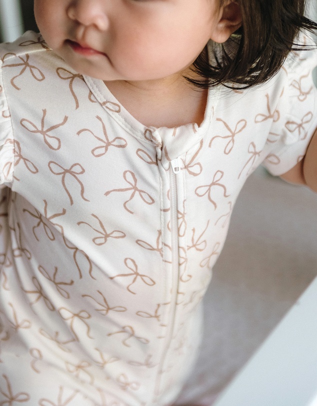 Kynd Baby - Day Or Night Short Sleeve Frill Onesie in Ivory Bow