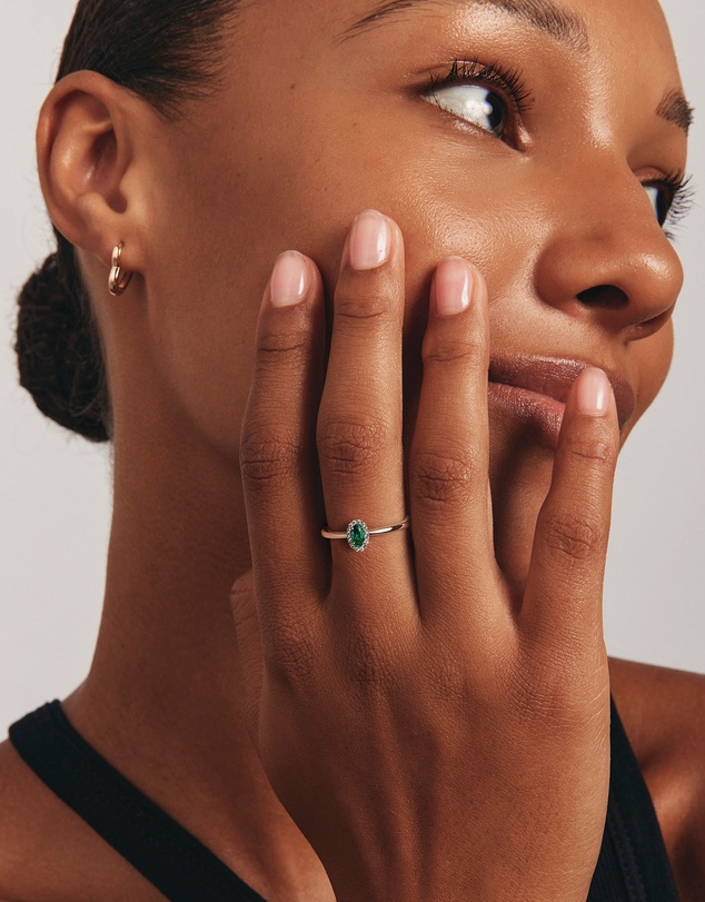 Michael Hill - Oval Cut Green Emerald Gemstone and 0.08 Carat TW Diamond Halo Ring in 10kt Yellow Gold