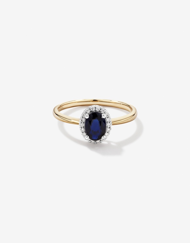 Michael Hill - Oval Cut Blue Sapphire Gemstone and 0.10 Carat TW Diamond Halo Engagement Ring in 10kt Yellow and White Gold