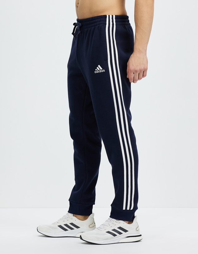 adidas Sportswear - Essentials Fleece Tapered Cuff 3-Stripes Pants