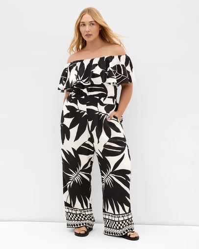 City Chic - Plus size Peta Border Oasis Print Jumpsuit - black