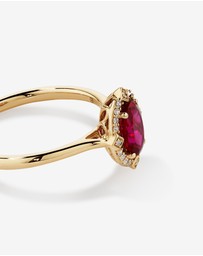Michael Hill - Oval Cut Created Ruby and Diamond Halo Ring in 10kt Yellow Gold