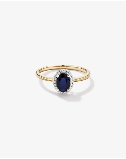 Michael Hill - Oval Cut Blue Sapphire Gemstone and 0.10 Carat TW Diamond Halo Engagement Ring in 10kt Yellow and White Gold