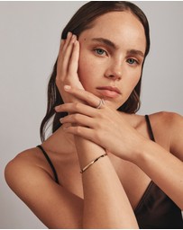 Michael Hill - Diamond Accent Oval Bangle in 10kt Yellow Gold