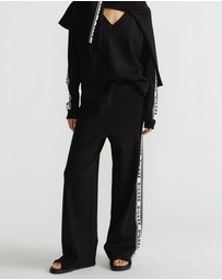 Decjuba - D-Luxe Logo Panel Knit Pants