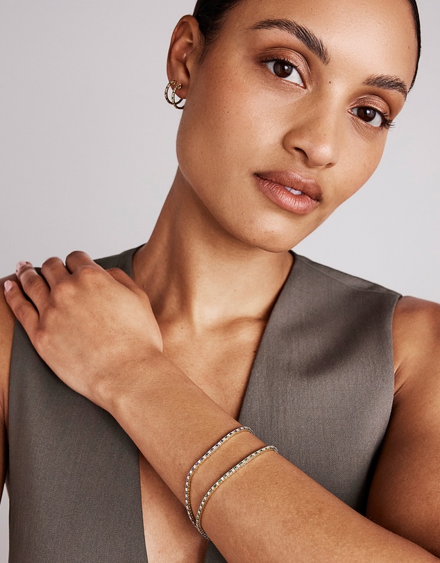Michael Hill - 0.22 Carat TW Diamond and Created Sapphire Huggie Hoop Earrings in 10kt Yellow Gold