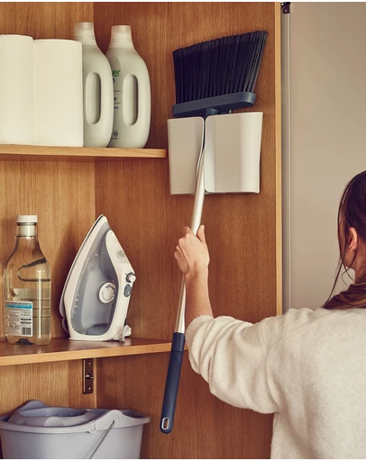 Joseph Joseph - CleanStore Wall-mounted Broom with Dust-shield Storage