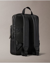 Calvin Klein - Emblem AOP Emboss Round Backpack