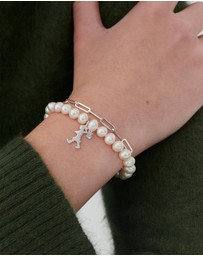 Karen Walker - Girl with the Pearls and Chain Bracelet