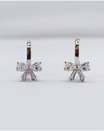 Izoa - Silver Bow Huggie Earrings
